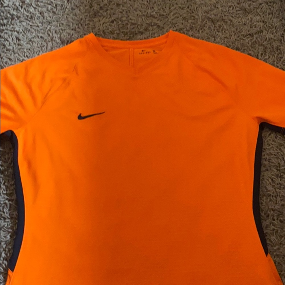 A neon orange Nike tee